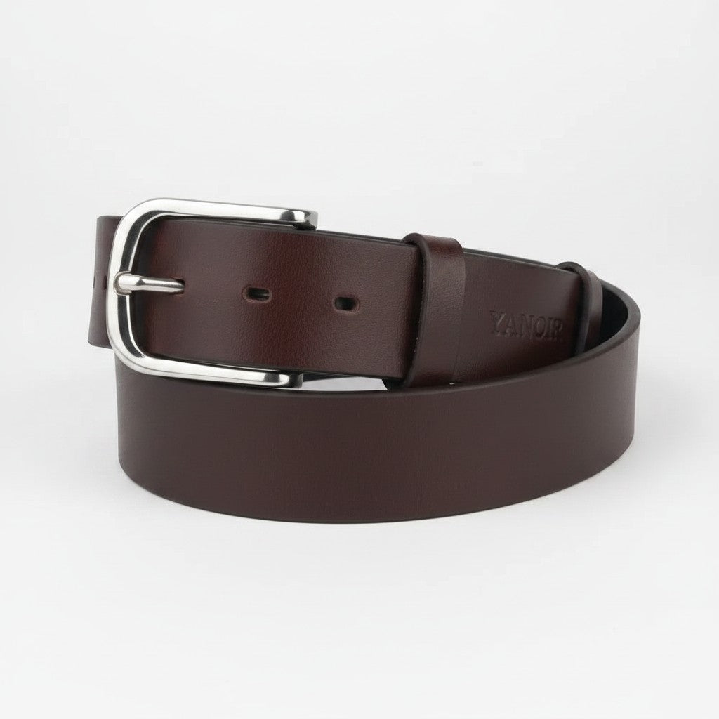 MODISTIAZ classic black genuine leather belt with polished silver buckle, smooth finish, and subtle embossed detail.