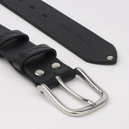 MODISTIAZ black leather belt with a silver buckle and embossed detail on the strap.