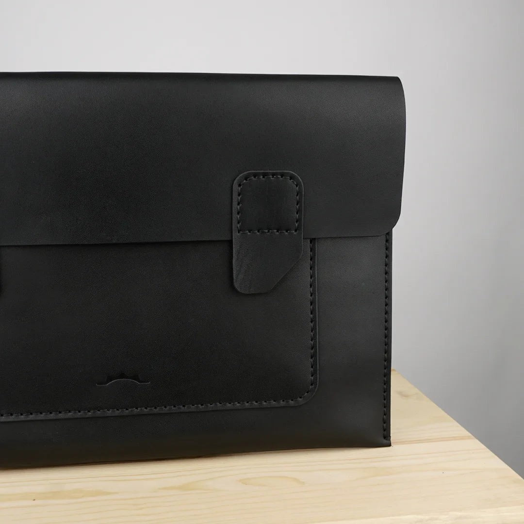 MODISTIAZ black leather document folio with snap closure and exterior pocket, perfect for business use.